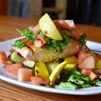 Blackened Salmon · Six Oz salmon filet served over grilled vegetables and topped with baby spinach, diced fresh...