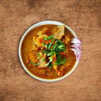 United Goat Curry · Tender goat meat cooked slowly with tomatoes, onions, fresh herbs and Indian spices.