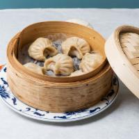 Pork Dumplings · Most popular. 6 pieces.  Steamed dumplings shown in picture.