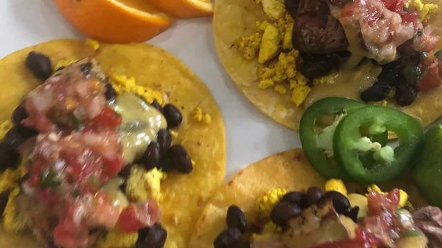 Breakfast Tacos · Gluten Free. Tofu scrambles, roasted potatoes, seasoned black beans smothered with vegan queso and pico on corn tortillas. Three tacos.