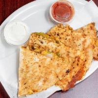 Quesadilla'S · Tortilla's stuffed with cheddar cheese, sweet peppers, jalapeño peppers, and onions. Served ...