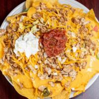 Loaded Nachos · Your choice of beef or chicken, topped with lettuce, jalapeño peppers, tomatoes, sour cream ...