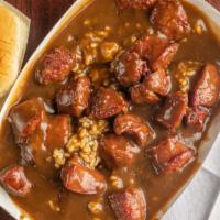 Sausage &Rice W/Gravy · Smoked beef sausages over rice and gravy.