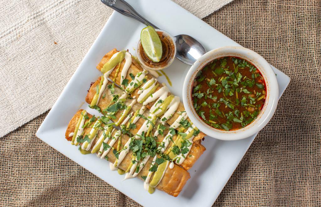 Flautas De Birria · 3 Birria flautas wrapped in a flour tortilla. Onion cilantro and cheese inside. Topped with sour cream and spicy jalapeño sauce. Comes with consome.