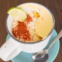 Vegan Esquites · Corn in a cup combined with vegan mayo, vegan cheese and chili lime powder..