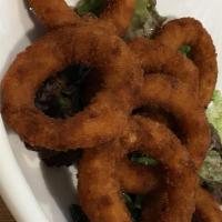 Onion Ring Tower · Sweet onions sliced and covered with our in house made beer batter and deep fried to a golde...