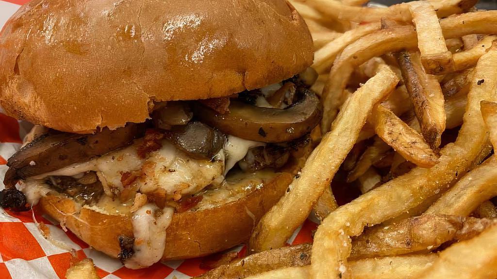 Mushroom Burger · Burger topped with melted swiss cheese the smothered with seasoned sauteed mushrooms on a lightly toasted brioche bun and finished off with our creamy horseradish sauce.
