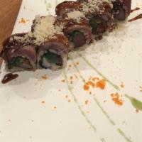 Isaac Roll · Peppered tuna, fresh jalapenos and  avocado topped with seared filet mignon and drizzle with...