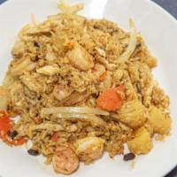 Pineapple Fried Rice · Spicy. Chicken and shrimp stir-fried with raisin, onions, egg, carrots and hint of curry wit...
