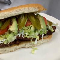 Azada Torta · Grill steak with cheese on telera bread with mayonnaise, lettuce, tomatoes, onions, jalapeño...