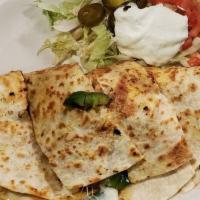 Chicken Fajita Quesadilla · Grilled chicken with bell peppers onion and tomato garnish with jalapeños sour cream and tom...