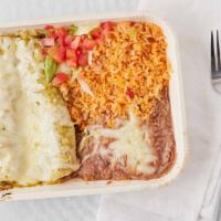 Spinach Enchiladas · Two corn tortillas slightly pan-fried, filled with spinach and cheese, topped with La Hacien...