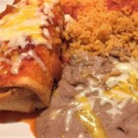 Grilled Chicken Chimichanga · A big flour tortilla filled with grilled chicken, rolled and fried to perfection. Topped wit...