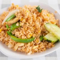 Thai Fried Rice · Rice with eggs, onions, and broccoli served with fresh cucumbers and tomatoes.