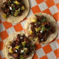Street Style Taco · Taco de pollo, carne asada, al pastor, grilled fish, or chorizo.