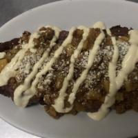 Plátano Rellenos Con Carne Molida · Ripe plantain with ground beef, cheese, and cream.