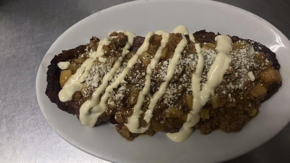 Plátano Rellenos Con Carne Molida · Ripe plantain with ground beef, cheese, and cream.