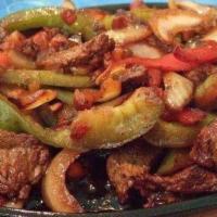 Fajita Mixtas · Chopped of steak, chicken, and mixed shrimp. With vegetables green pepper, onions, and tomato.