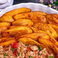Plantain / Sweet Potato With Egg Stew · Eggs fried omelette style with peppers and sliced bread.