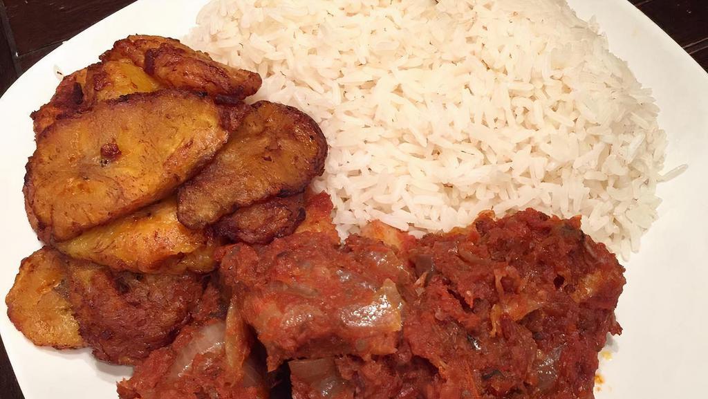 White Rice & Stew · Our rice plates are served with a side of sweet plantains with a choice of meat: Goat meat, chicken, fish or lamb meat.