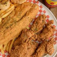 Chicken & Fish Platter · Six pieces of chicken drummettes and one piece of fish served with fries and garlic bread.