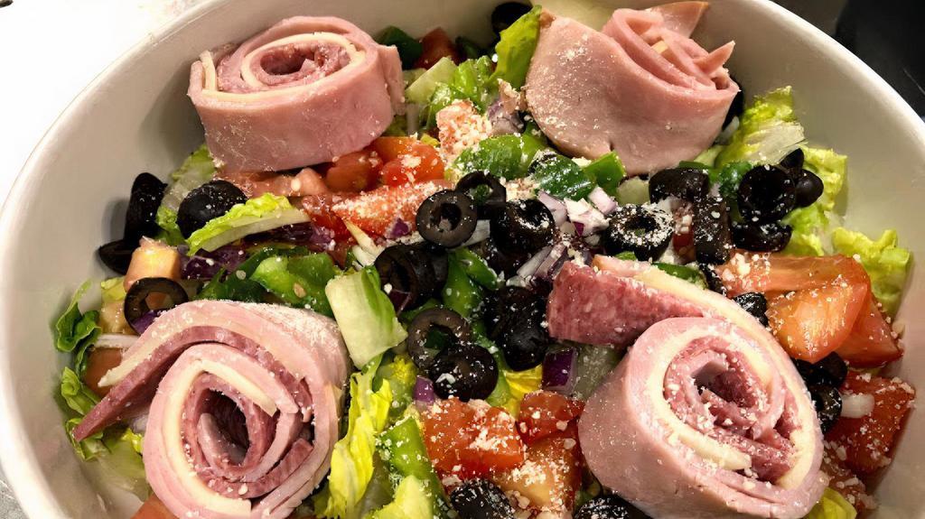 Antipasto · Tomato, red onion, black olive, green pepper and pepperoncini pepper on a bed of romaine with ham, salami, provolone and Parmesan cheese