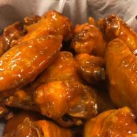 10 Piece Bone In Wings · Served with your choice of ranch or blue cheese