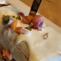 Breakfast Cali Burrito · Two scrambled eggs, peppers, onions, tomato, tater tots, sausage, bacon, country ham, gouda ...