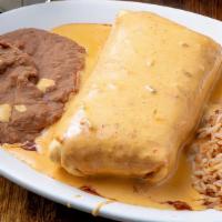 Chimichanga  · Flour tortilla filled with your choice of meat and cheese. Crispy fried and topped with ranc...