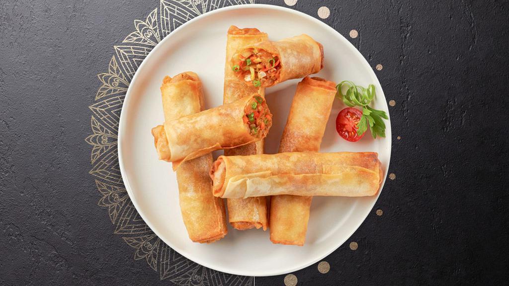 Chicken Spring Rolls · Chicken wrapped in rice wrapper and fried until golden crisp