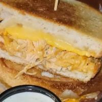 Buffalo Chicken Grilled Cheese · Pulled buffalo chicken with american and pepper jack cheeses on toasted sourdough bread