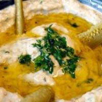 Baba Ghanoush · Roasted eggplants mashed-in with tahini sauce, mixed with fresh minced garlic, fresh lemon j...