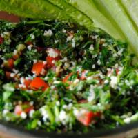 Tabbouleh Salad · A healthy mediterranean salad consisting of chopped parsley, bulgur wheat, diced tomatoes. S...