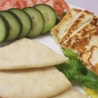 Halloumi Cheese Plate · Grilled halloumi slices, served with slices of tomatoes and cucumbers, plus warm pita.