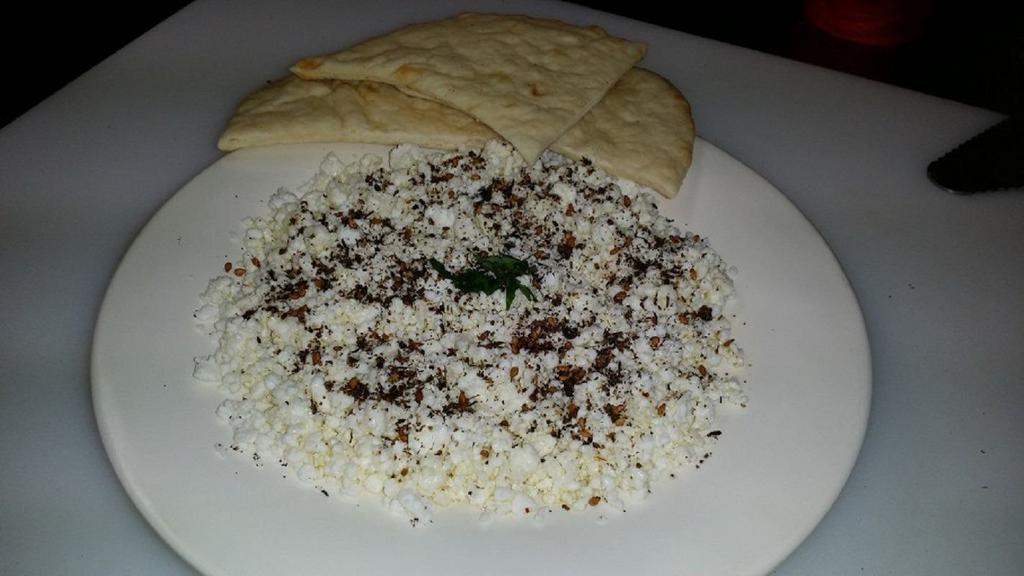 Fresh Feta Cheese Plate · Topped with zatar (a herb), e.v. olive oil, with pita.