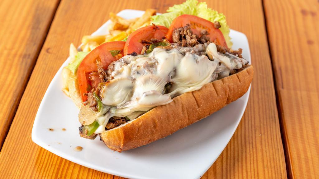 Philly Steak · Fresh grilled thinley sliced sirloin with onions, mushrooms, and green peppers, topped with shredded mozzarella cheese, mayonnaise, lettuce, and tomatoes on a fresh-baked baguette roll.