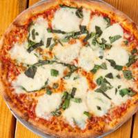 Prosciutto Pizza · Home-made white sauce, arugula, basil, fresh mozzarella, imported Italian prosciutto.