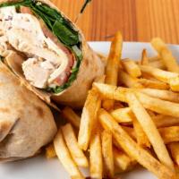 Greek Chicken Wrap · Our grilled chicken breast with shredded mozzarella and feta cheese, spinach, onions, tomato...