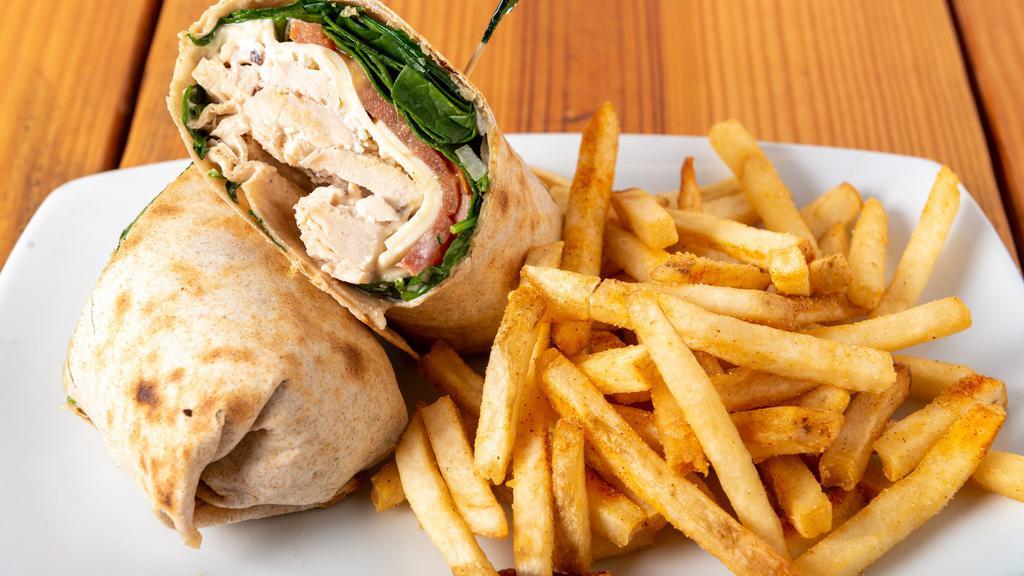 Greek Chicken Wrap · Our grilled chicken breast with shredded mozzarella and feta cheese, spinach, onions, tomatoes, and our home-made garlic mayonnaise in a wheat wrap.