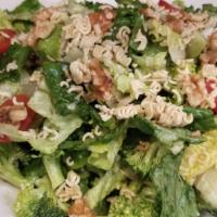 Crunchy Broccoli · Romaine, grape tomatoes, crunchy walnuts, and noodles tossed in sweet red wine.