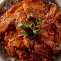 Spicy Cajun Chicken Bowl · Slow cooked chicken in our spicy cajun tomato sauce. Served over steamed rice and with a sid...