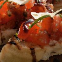 Bruschetta · Vine ripe tomatoes with garlic and basil on toasted artisan bread, Parmesan, balsamic reduct...