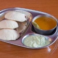 Idli · Steamed rice and lentil patties. Served with savory sauces.