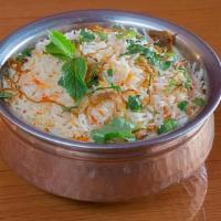Goat Biriyani · Basmati rice with fresh cardamom, mint and saffron, and slow cooked in a sealed pot. Served ...