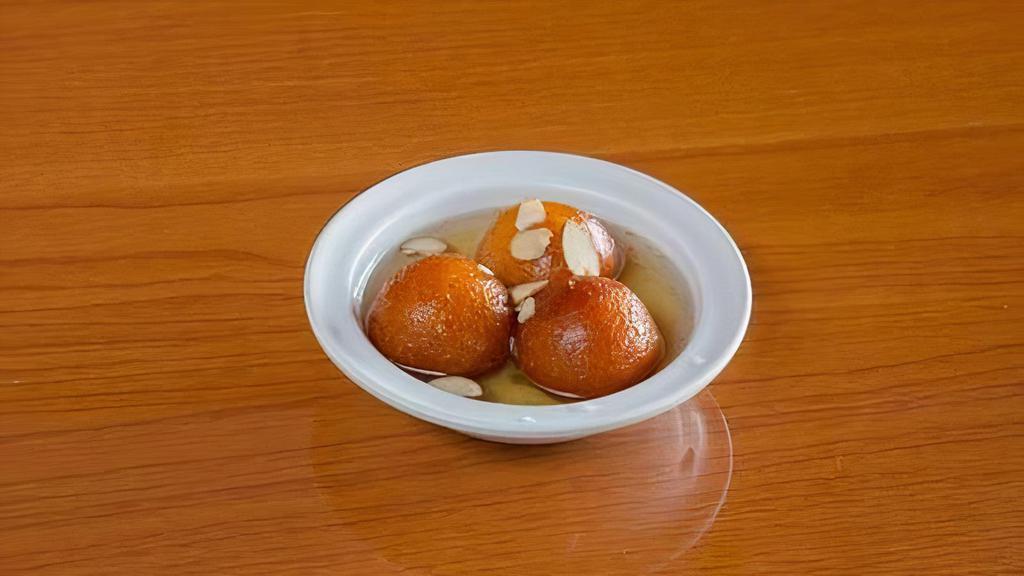 Gulab Jamun · Fried cheese balls soaked in honey syrup served warm.
