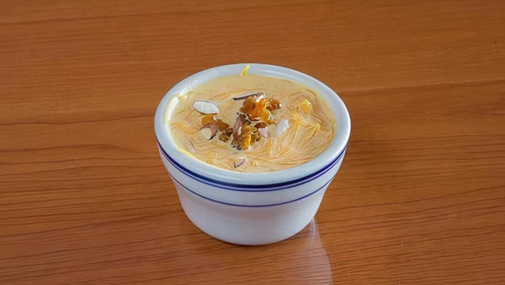 Madras Payasam · Vermicelli cooked in milk, honey, garnished with nuts, and raisins.