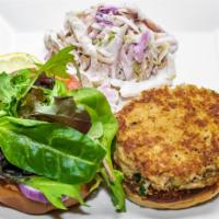 Crab Cake · Pan-fried select crab meat on a brioche bun with chipotle mayo and blue cheese bacon coleslaw.