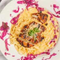 Theresa'S Sweet Chili Linguine · Pasta tossed in a Thai chili cream sauce, topped with grilled blackened chicken. Topped with...