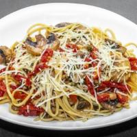 Linguine Pietro · Pasta tossed with mushrooms, sun-dried tomatoes, garlic and capers in white wine and olive o...