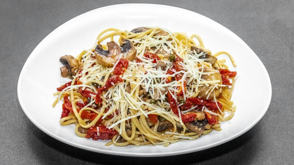Linguine Pietro · Pasta tossed with mushrooms, sun-dried tomatoes, garlic and capers in white wine and olive oil. Topped with Parmesan cheese.